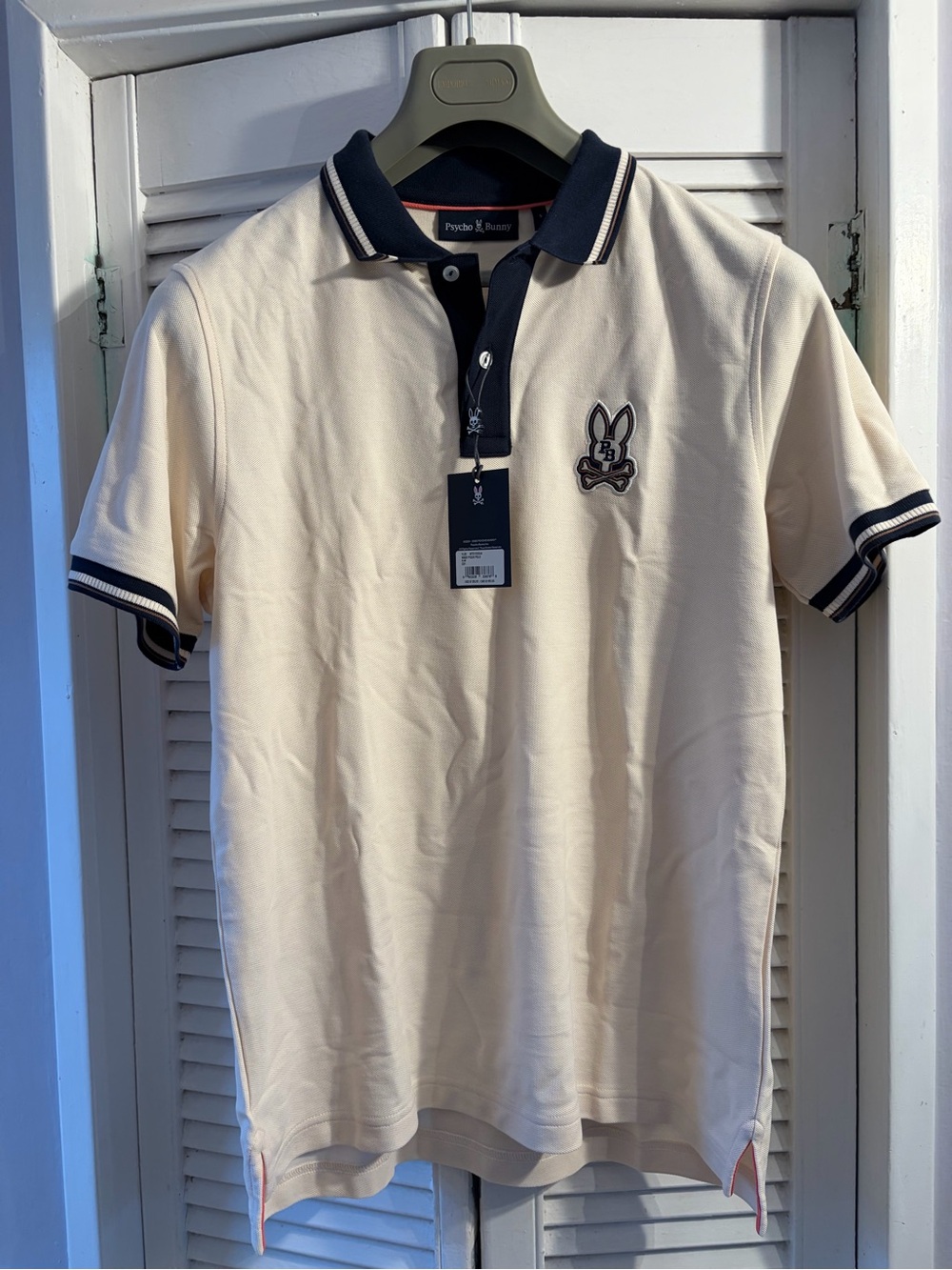 Psycho Bunny Cream Polo with Navy Trim and Embroidered Logo